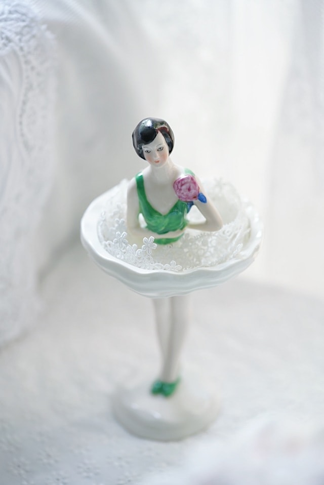still-life-white-figurine-green-toy picture material